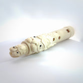 A contemporary hand carved flute. This piece is made from bone and is a fully functioning musical instrument and can be played. Beautiful art hand made by Yuri Terenyi. Flute with Dragons head.